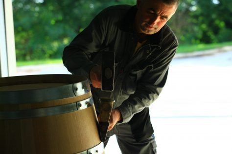 A man working on a wine barrel
